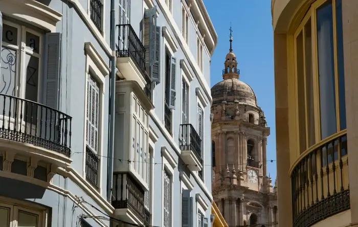 Street in Málaga old town with the cathedral behind